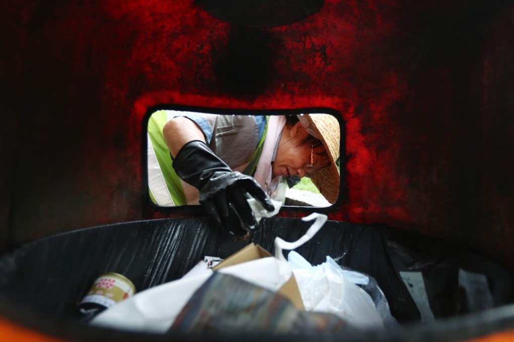 The outsourcing of lower-end civil service jobs means street cleaning is now under private companies, with many elderly street cleaners no longer eligible for government benefits. Photo: Nora Tam