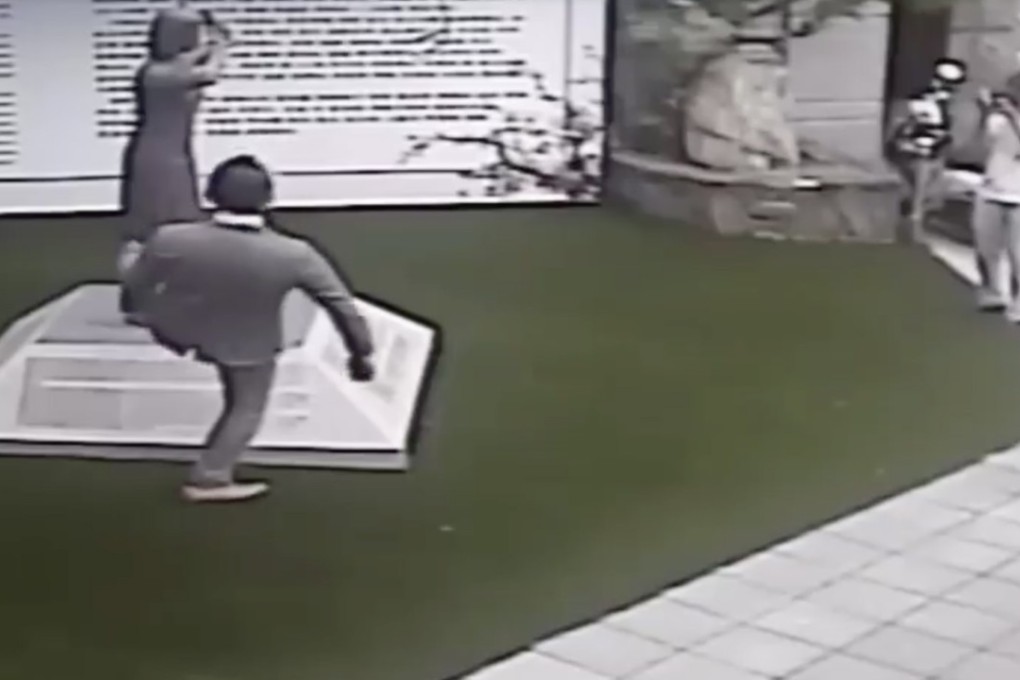 Japanese activist Mitsuhiko Fujii kicked the statue as he was leaving the Kuomintang’s office in Tainan, after he had asked for the memorial to be removed. Photo: Facebook