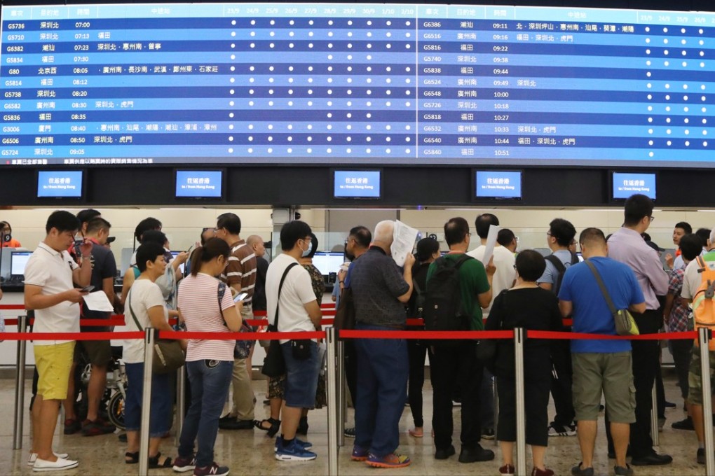 Passengers queue to buy advanced tickets at the West Kowloon terminus. Photo: Nora Tam