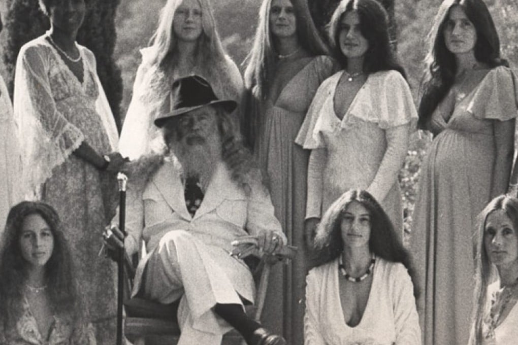 David Berg (seated) founded the Children of God cult whose members included River and Joaquin Phoenix and Rose McGowan when they were children. Photo: Alamy