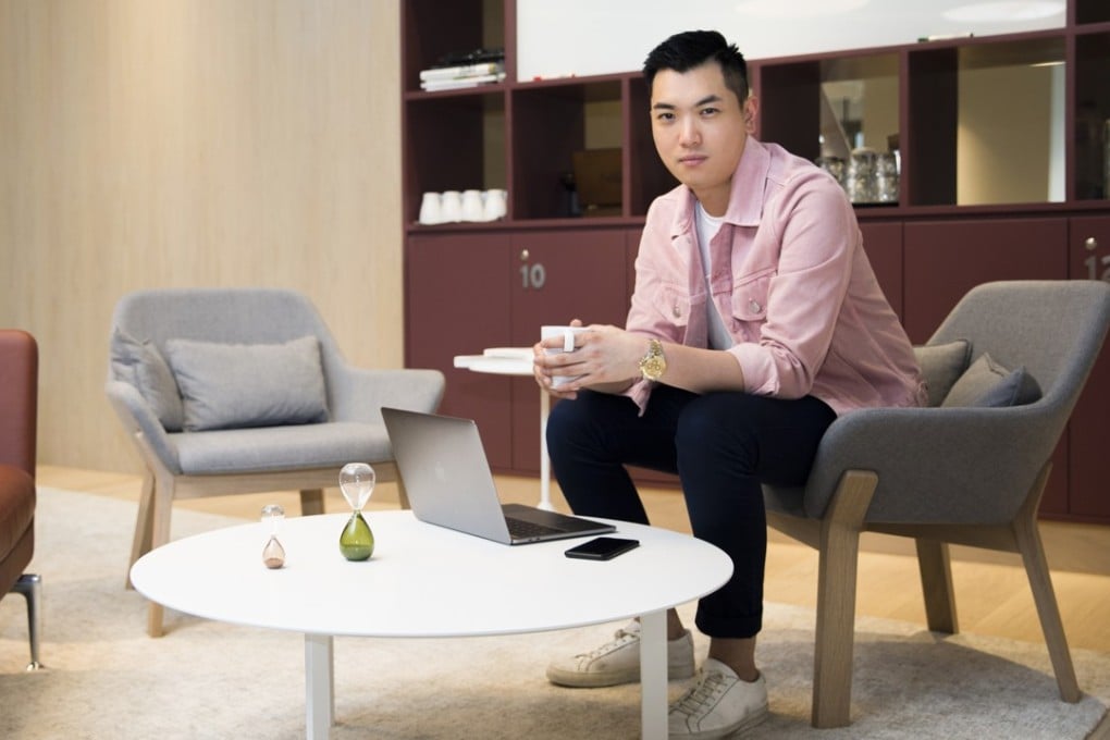 Justin Ng wears a pink denim jacket by Sandro, white T-shirt by Muji, blue 484 slim-fit chinos by J. Crew and white Original Achilles leather sneakers by Common Projects. Photo: Michelle Wong