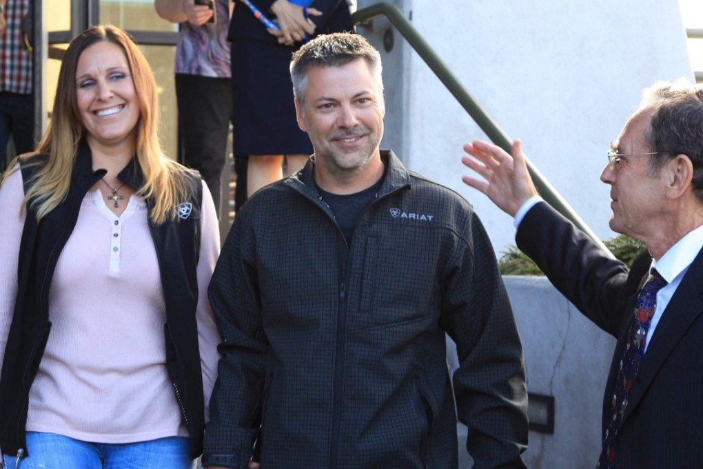 This image courtesy of the Oregon Innocence Project (OIP) shows, Joshua Horner and his wife Kelli walk from the Deschutes County Jail in Bend, Oregon, on August 3, with Steve Wax, OIP's Legal Director. -Photo: Agence France-Presse
