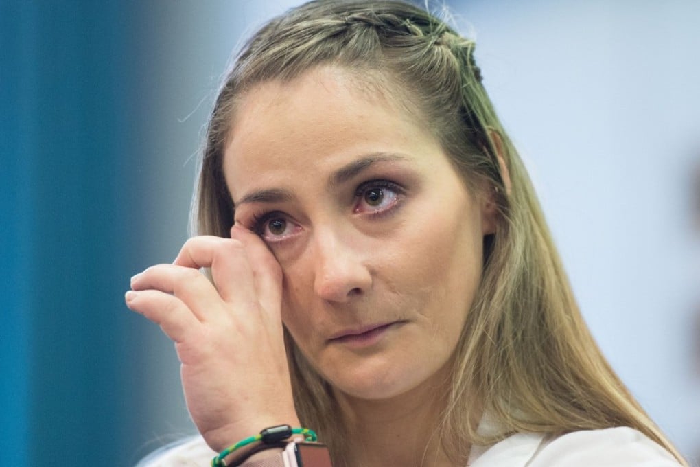 Kristina Vogel sheds a tear as she meets the press in a Berlin hospital. Photo: AFP