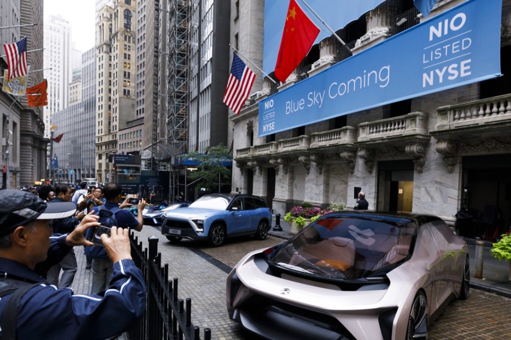 Models from the Chinese electric vehicle maker Nio are parked in front of the New York Stock Exchange on Wednesday, as Nio holds its initial public offering on the exchange. Photo: EPA-EFE
