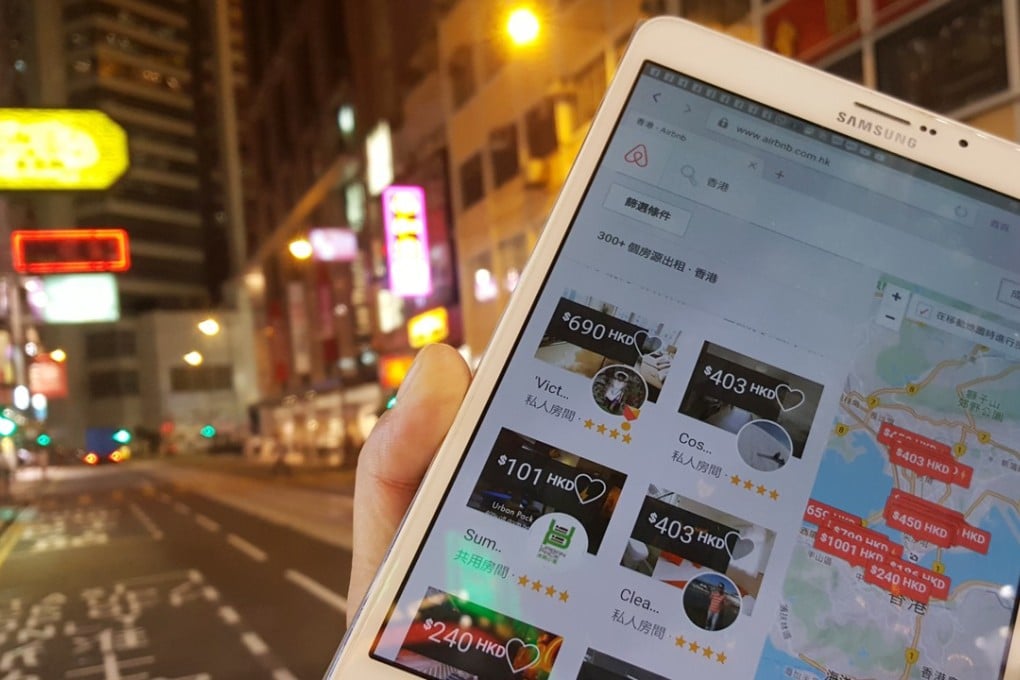 A tourist checks out Airbnbs on his mobile in Causeway Bay. Without flat-sharing platforms providing accommodation in Hong Kong, would some tourists have gone elsewhere? Photo: Martin Chan