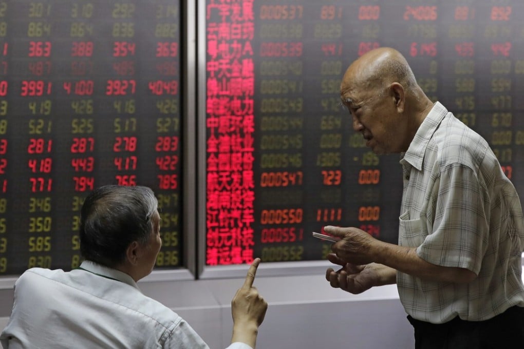 People chat as they monitor stock prices at a brokerage house in Beijing, Thursday, Aug. 16, 2018. Asian shares are falling as investors fret over slowing economic growth, especially in China. Technology stocks and oil and metals prices skidded overnight on Wall Street. (AP Photo/Andy Wong)