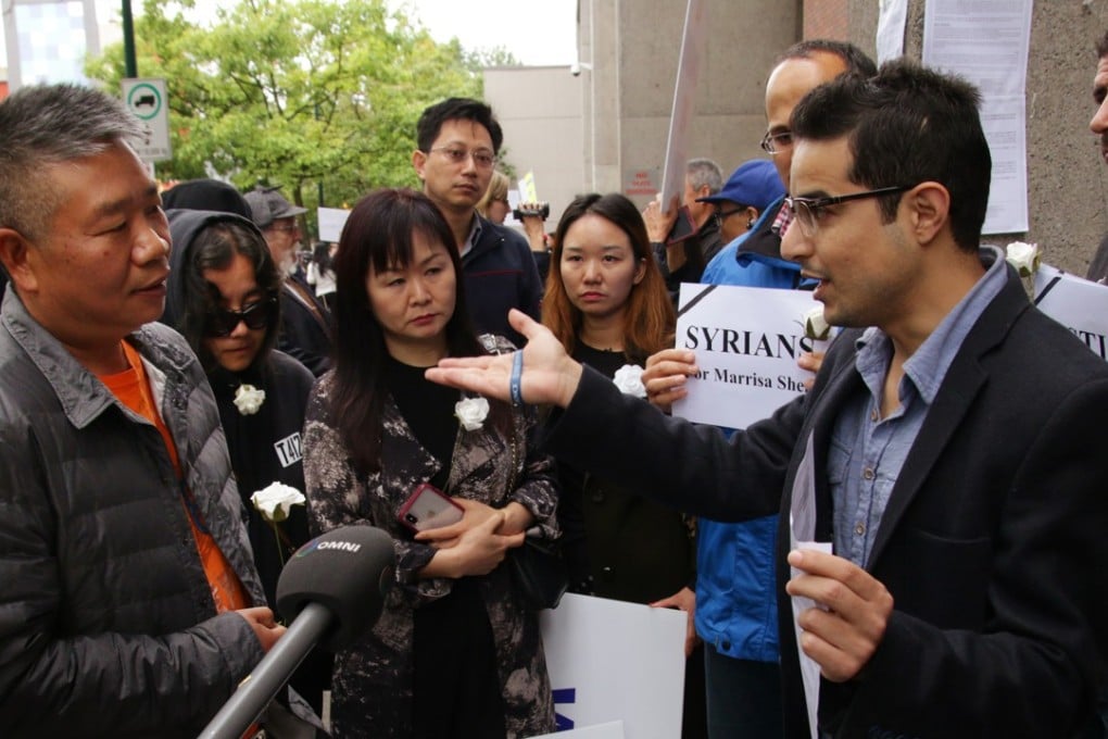 Canadians of Chinese and Syrian descent speak outside the Vancouver courthouse on Friday. Photo: Rob Kruyt/SCMP