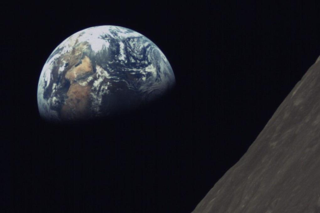 An image of the Earth and the lunar surface sent back by the Chang’e 4’s relay satellite as it orbited the moon. Photo: Xinhua