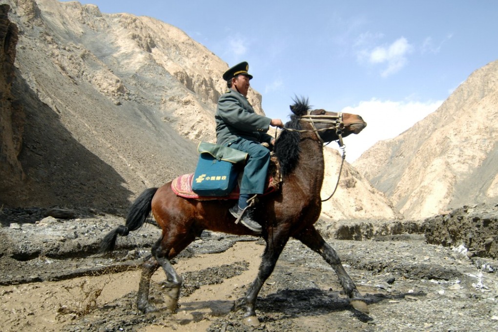 A postman undertakes the lonely job of delivering mail in the Pamir Mountains, serving more than 5,000 nomads scattered around the remote western region of China, in March 2012. Photo: Xinhua