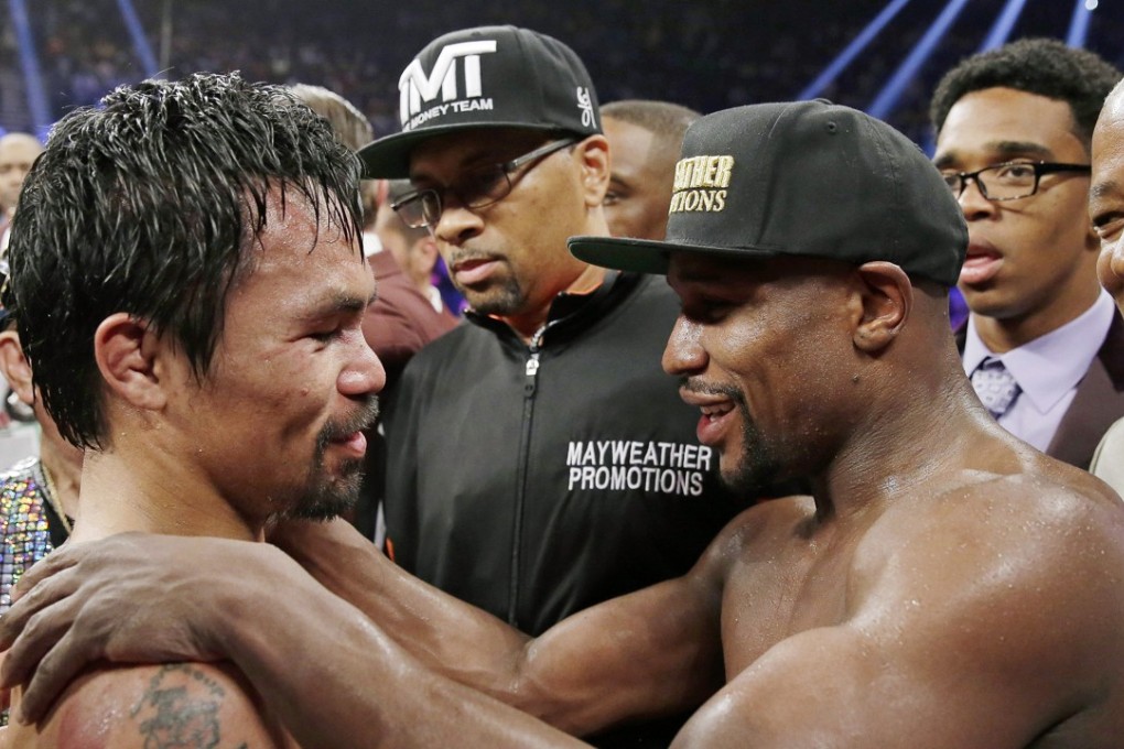 Manny Pacquiao and Floyd Mayweather Jnr embrace in the ring at the finish of their first welterweight title fight in Las Vegas. Photo: AP