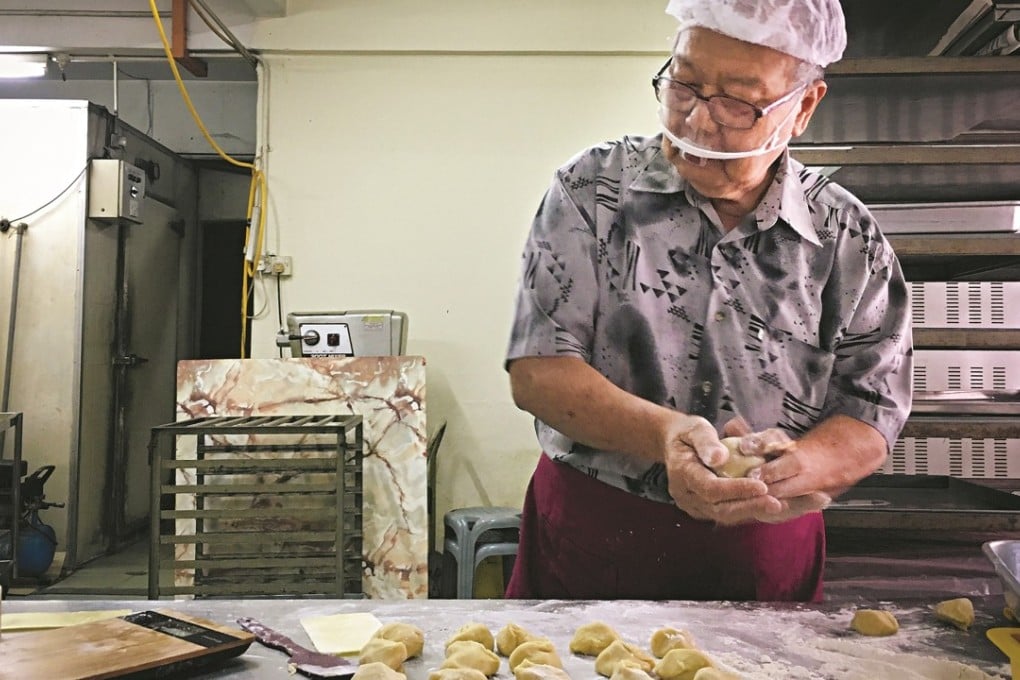 Goh Kean, who founded Fook Pan Food Industries with his wife, makes mooncakes in their Kuala Lumpur factory. Photo: Samantha Cheh