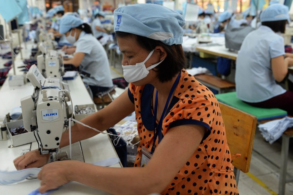 A production line at a garments factory in the outskirts of Hanoi, Vietnam. Trade agreements’ labour provisions remain largely cosmetic, with little practical effect. Photo: AFP