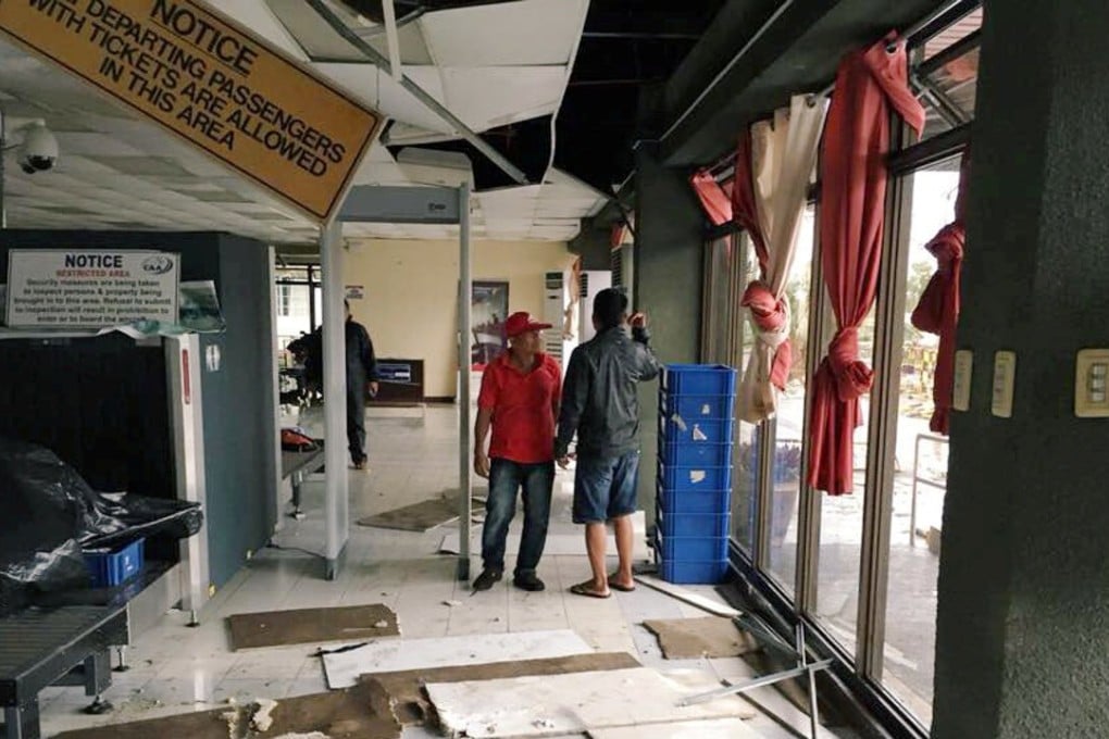 Tuguegarao airport terminal was badly damaged, its roof and glass windows shattered by strong wind, which also sent chairs, tables and papers flipping about inside. Photo: Reuters