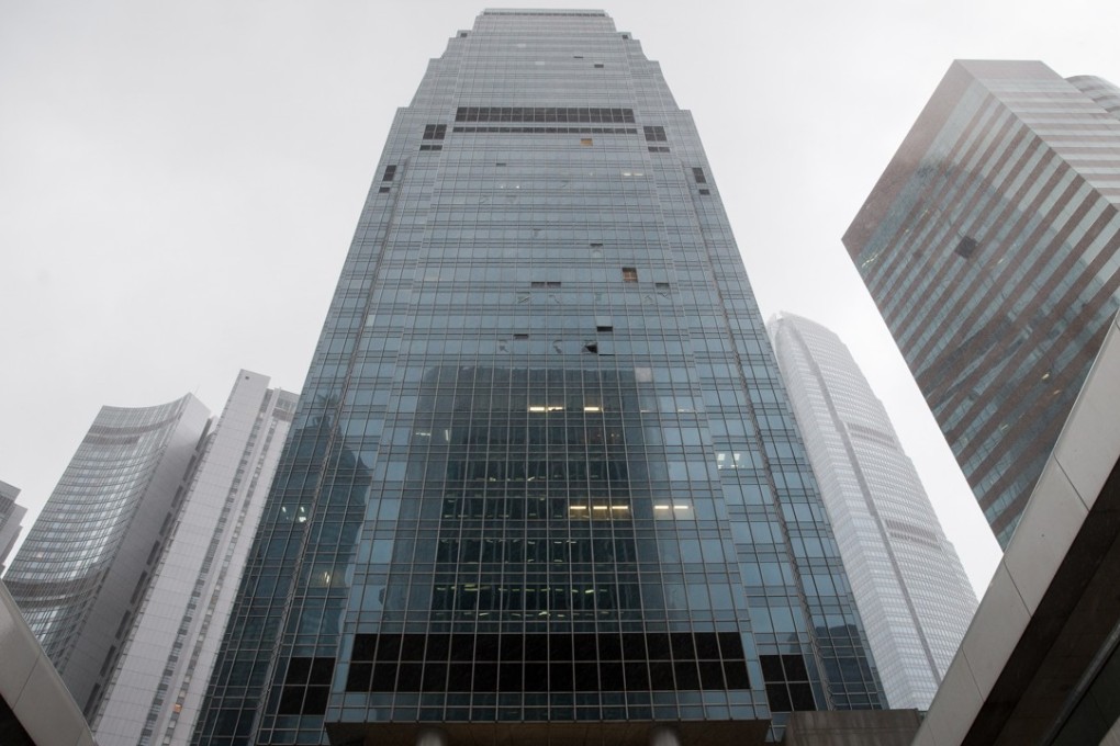 Broken window panels are seen on the One International Finance Centre building in Central, Hong Kong. Photo: EPA