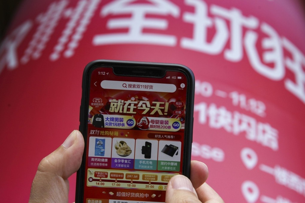 A mobile phone screen shows the Taobao app displaying the Singles' Day shopping festival promotion, in a street in Shanghai, 2017. Photo: SCMP