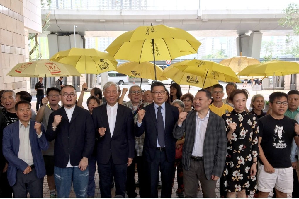The nine defendants, (from left to right) Tommy Cheung, Lee Wing-tat, Shiu Ka-chun, Reverend Chu Yiu-ming, Dr Chan Kin-man, Benny Tai, Tanya Chan, Raphael Wong Ho-ming and Eason Chung outside West Kowloon Court. Photo: Jasmine Siu