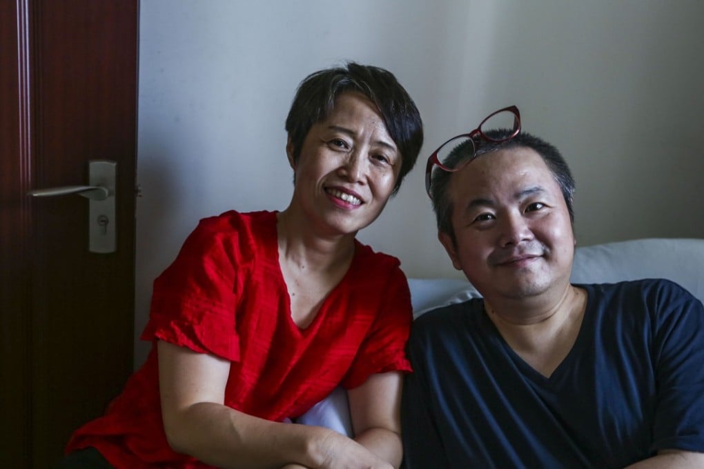 Li Hong, who suffers from Becker muscular dystrophy, with his wife, Hu Ying, who lost the ability to walk at the age of 13, at their home in Shenzhen, China. Picture: Xiaomei Chen