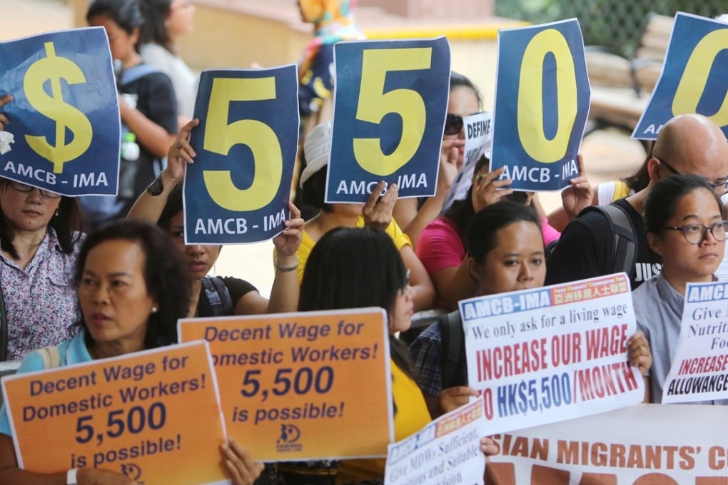 Domestic helpers protesting for higher wages outside the Harbour Building in Central in August. Fifteen representatives from two of the most active helpers’ groups asked for a 24.7 per cent increase in their monthly wage to HK$5,500. Photo: Winson Wong