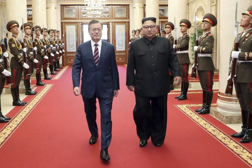 South Korean President Moon Jae-in (left) and North Korean leader Kim Jong-un arrive at the headquarters of the Central Committee of the Workers’ Party in Pyongyang, North Korea on September 18, 2018. Photo: AP