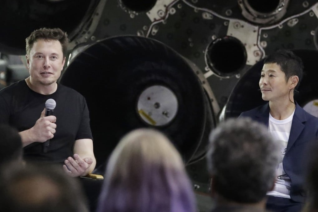SpaceX founder and chief executive Elon Musk, left, announces Japanese billionaire Yusaku Maezawa, right, as the first private passenger on a trip around the moon on Monday in Hawthorne, California. Photo: AP