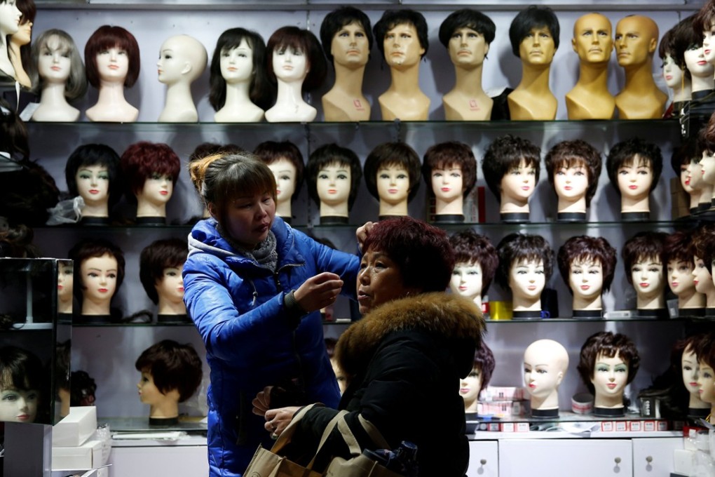 A wig shop in Shanghai. China is the second-largest exporter of human hair to the US, which is often processed into wigs. The category was exempt from new tariffs published on Monday in America. Photo: Reuters