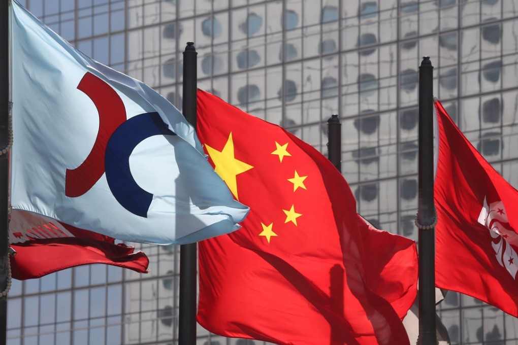 Hong Kong stocks were under pressure in morning trade on Tuesday, hours after Washington formally unveiled new tariffs on US$200 billion worth of Chinese goods. They pared back those losses to end higher. Photo: Dickson Lee