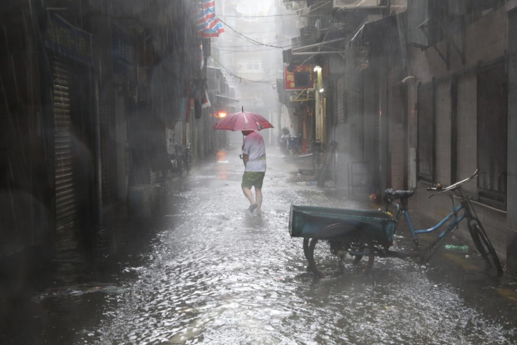 A man walks down the flooded Rua de Cinco de Outubro street in Macau as Typhoon Mangkhut approached on September 16. Photo: Dickson Lee