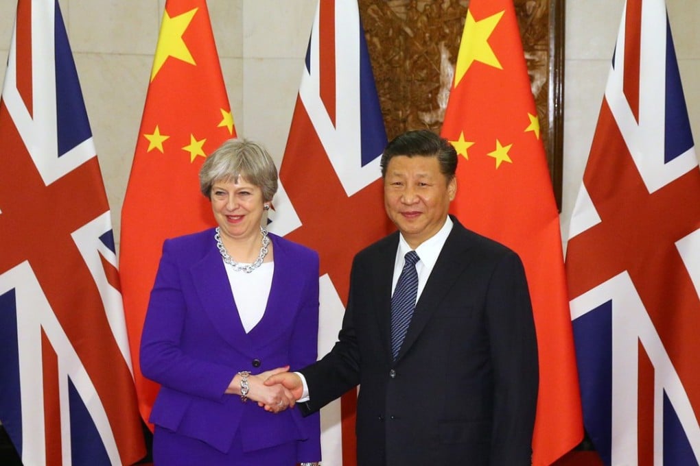 Chinese President Xi Jinping shakes hands with Britain's Prime Minister Theresa May ahead of their meeting at the Diaoyutai State Guesthouse in Beijing on February 1, 2018. Photo: AFP