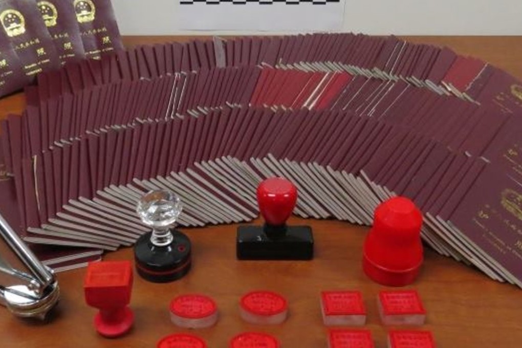 An array of Chinese passports that were endorsed with fake and doctored stamps by Canadian immigration consultant Xun Wang. Wang's tactics helped rich migrants maintain the illusion of their presence in Canada when they were actually living and working in China. Photo: CBSA