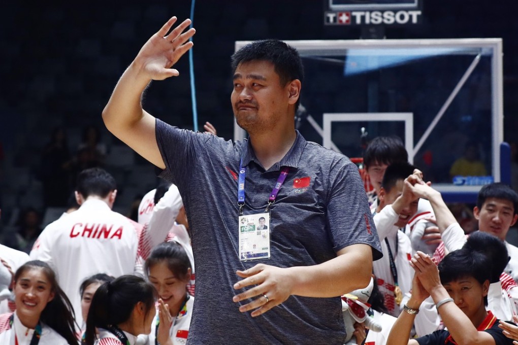 Former Chinese basketball player Yao Ming (centre) joins Team China on the podium after they won gold in the men’s and women’s basketball five on five finals at the 2018 Asian Games in Jakarta, Indonesia. Photo: EPA