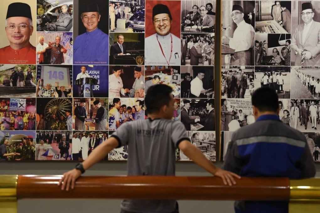 Pictures of Malaysian leaders at Umno’s offices in Kuala Lumpur. Photo: AFP