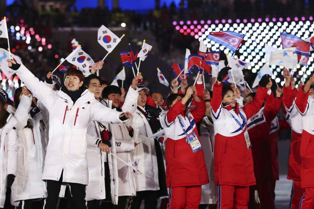 North and South Koreans wave flags during the closing ceremony of the 2018 Winter Olympics in Pyeongchang, South Korea. Photo: AP