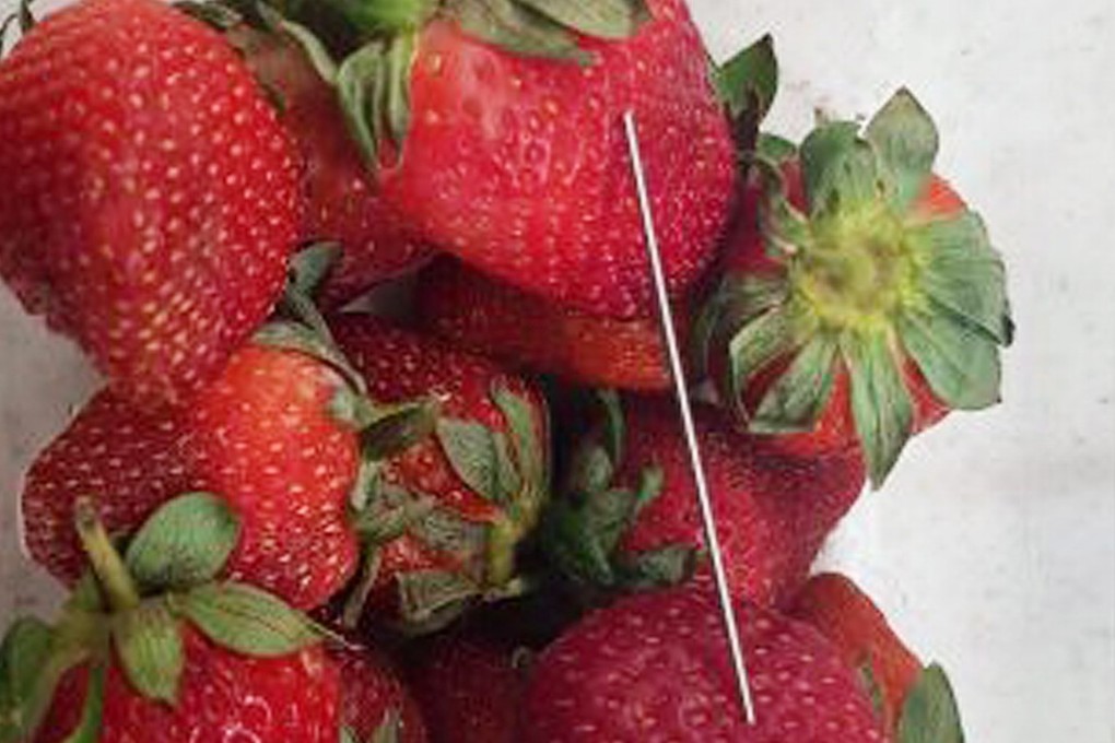 A needle in a punnet of strawberries. Australia plans to increase the maximum jail term to 15 years for anyone convicted of contaminating foodstuffs. Photo: AFP