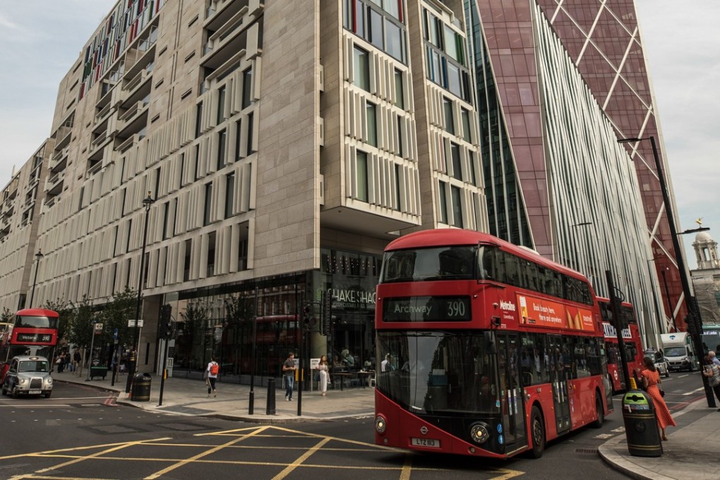 A bus passes The Nova Building, a mixed residential and commercial use building, in the Westminster borough of London. Jitters surrounding the British capital city's property market are finally starting to show up in home prices, but for many young people, buying their own home outright is still out of reach financially, and co-living as a concept is gaining in popularity as a result. Photo: Bloomberg