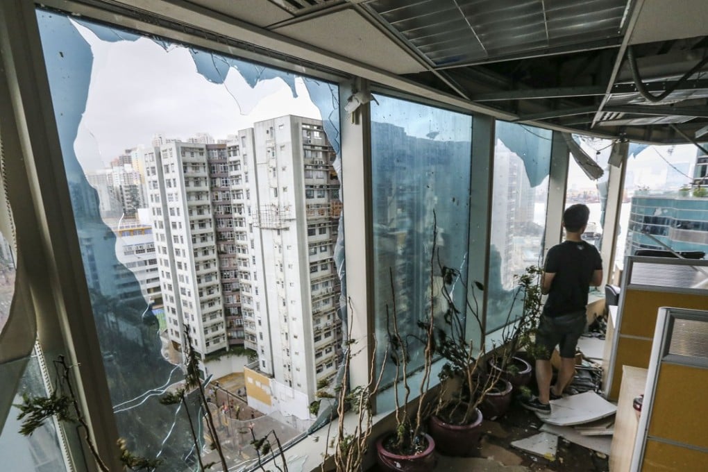 Blown-out windows as seen from inside the One Harbourfront office building in Hung Hom on September 17, a day after Typhoon Mangkhut left a trail of devastation in Hong Kong. Photo: Felix Wong