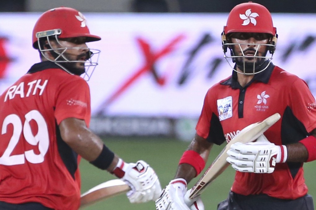 Hong Kong captain Anshuman Rath (left) and Nizakat Khan run between the wickets against India. Photo: AP