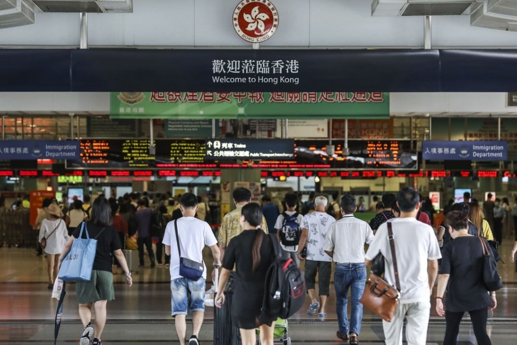People cross the Lok Ma Chau border station from Shenzhen into Hong Kong on September 4. Photo: Roy Issa