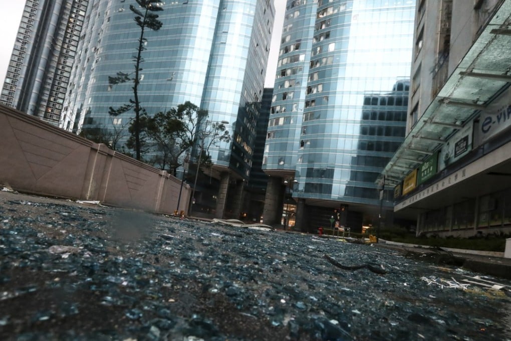 Broken windows and glass are seen strewn on the grounds surrounding Harbour Grand Kowloon in Whampoa, Hung Hom. Photo: Nora Tam