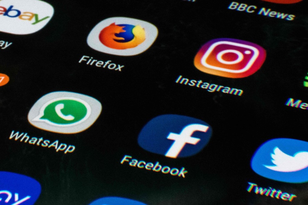 Social networking apps on a mobile phone screen. Photo: AFP