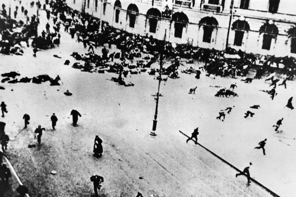 Russian forces open fire on a Bolshevik protest in Petrograd, in July 1917. In 1921, Lenin revoked the citizenship of Russians who had fled overseas. Pictures: Alamy