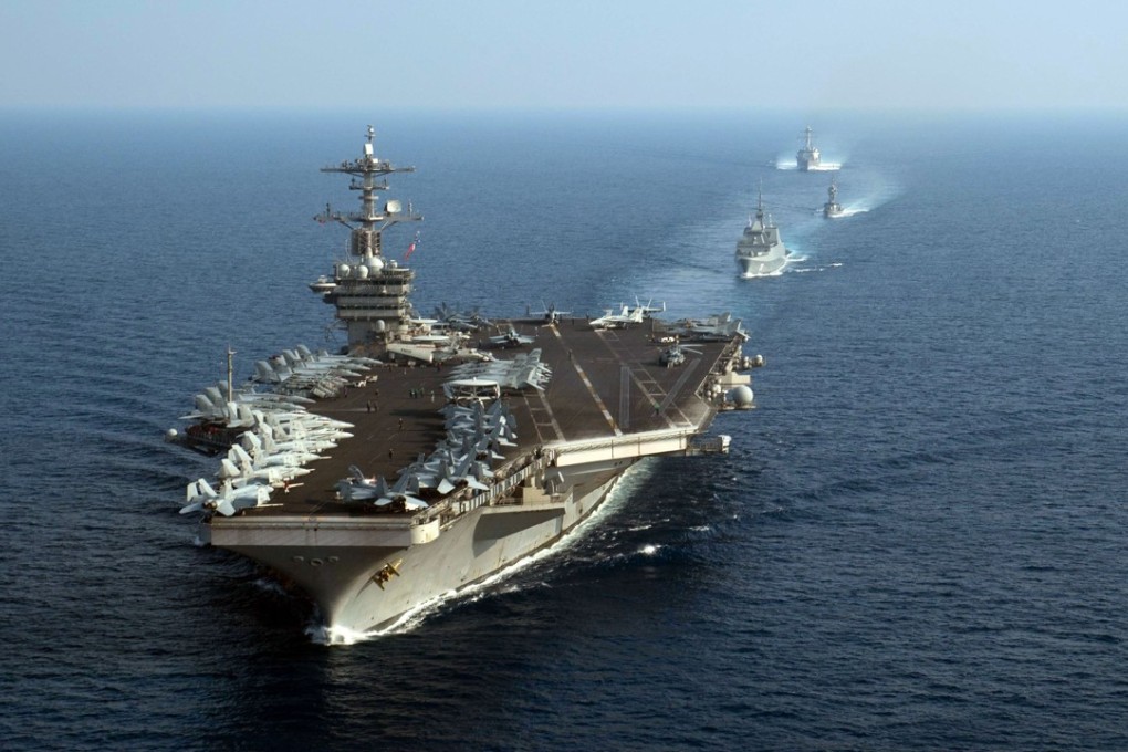 Aircraft carrier USS Theodore Roosevelt leads a formation of American and Singaporean navy ships during an exercise in the South China Sea in April. Photo: AFP