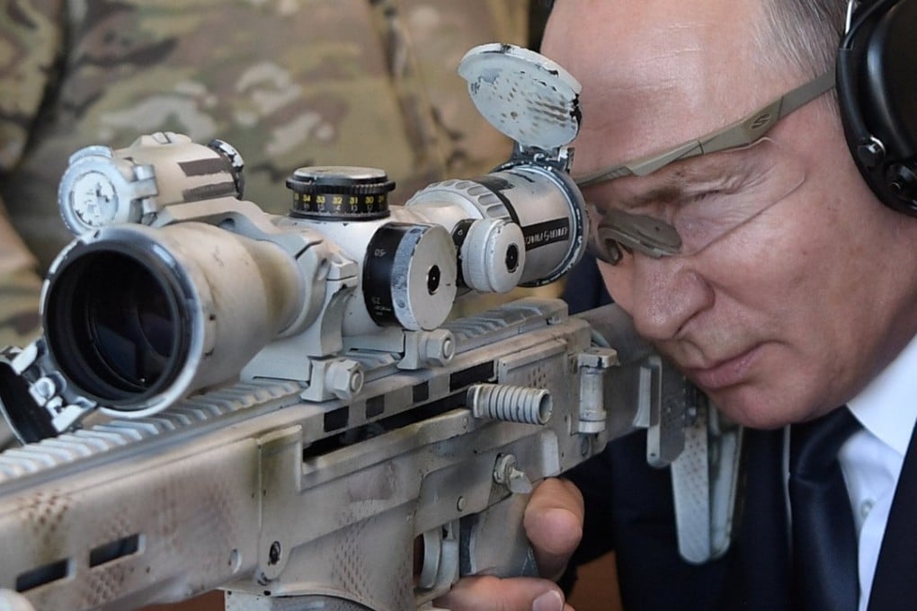 Russian President Vladimir Putin aims a Chukavin sniper rifle at a firing range outside Moscow, on Wednesday. Photo: Reuters