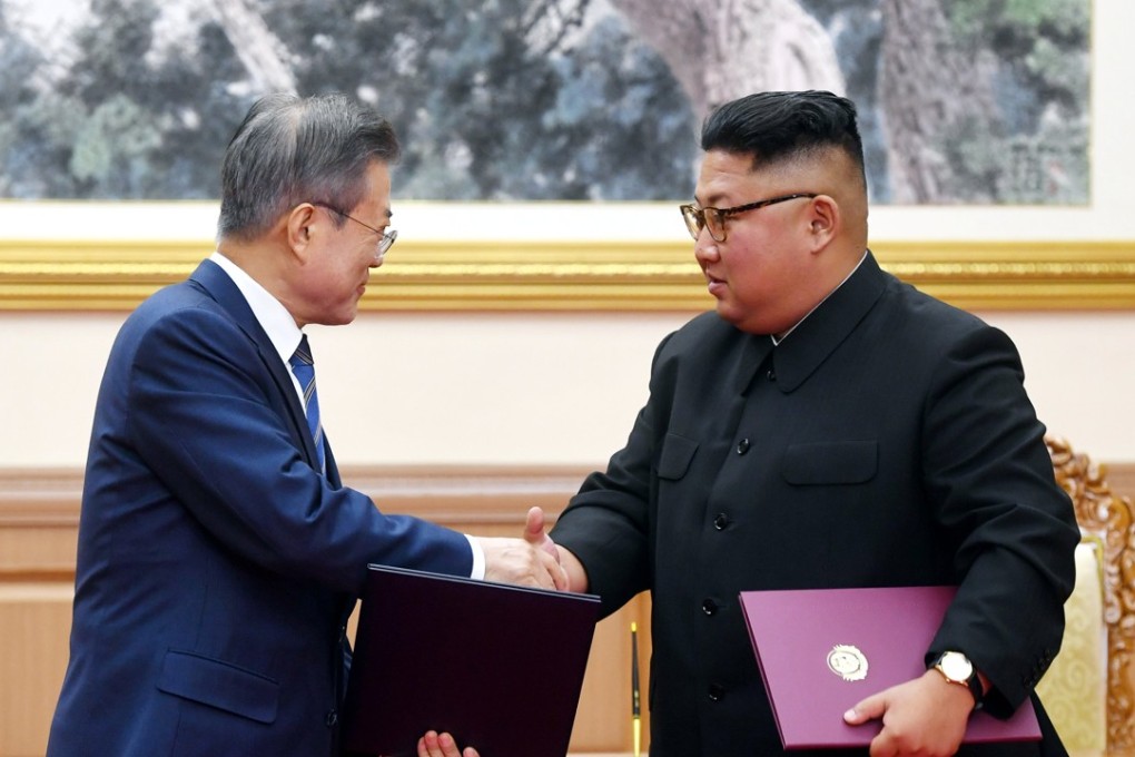 South Korean President Moon Jae-in shakes hands with North Korean leader Kim Jong-un after signing the joint statement in Pyongyang. Photo: Pyongyang Press Corps/Reuters