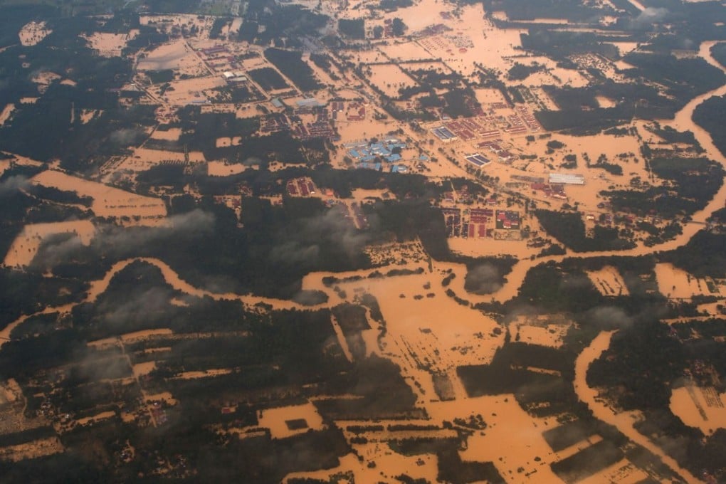 An aerial view of houses and plantations submerged in floodwaters in Malaysia in 2017. It was Malaysia's worst flooding in decades, forcing more than 100,000 people to flee. Photo: AFP