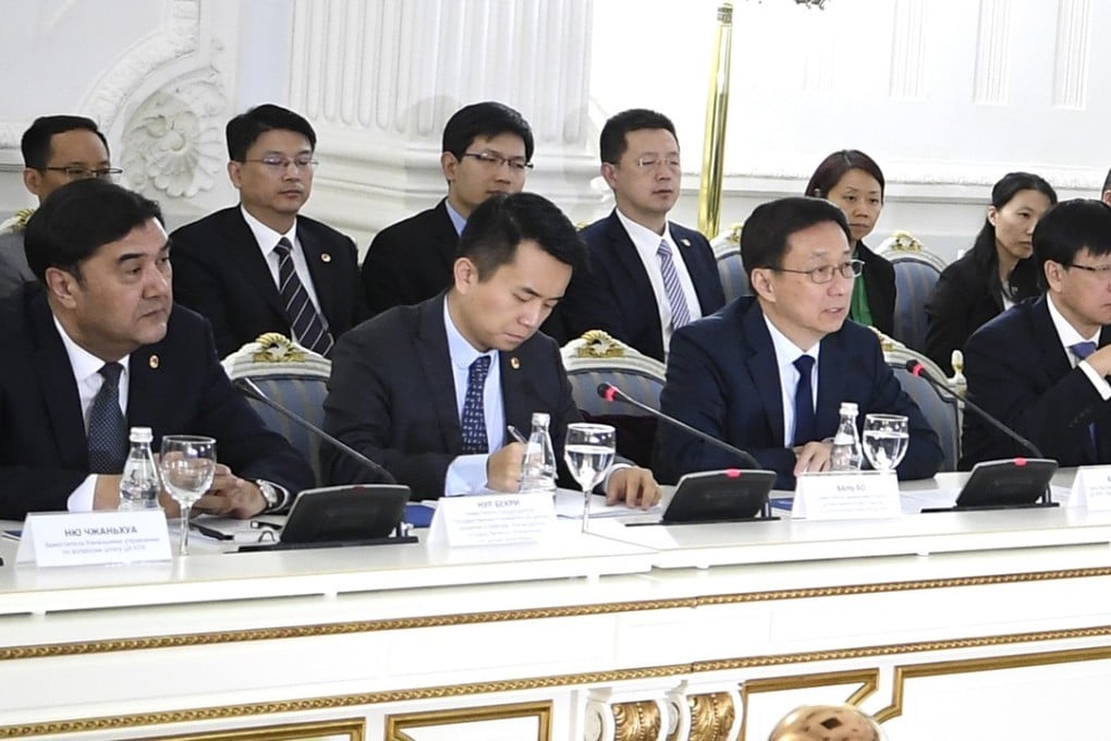 Nur Bekri (left) was last seen on Wednesday while accompanying Vice-Premier Han Zheng (second right) on a trip to Russia. Photo: Xinhua