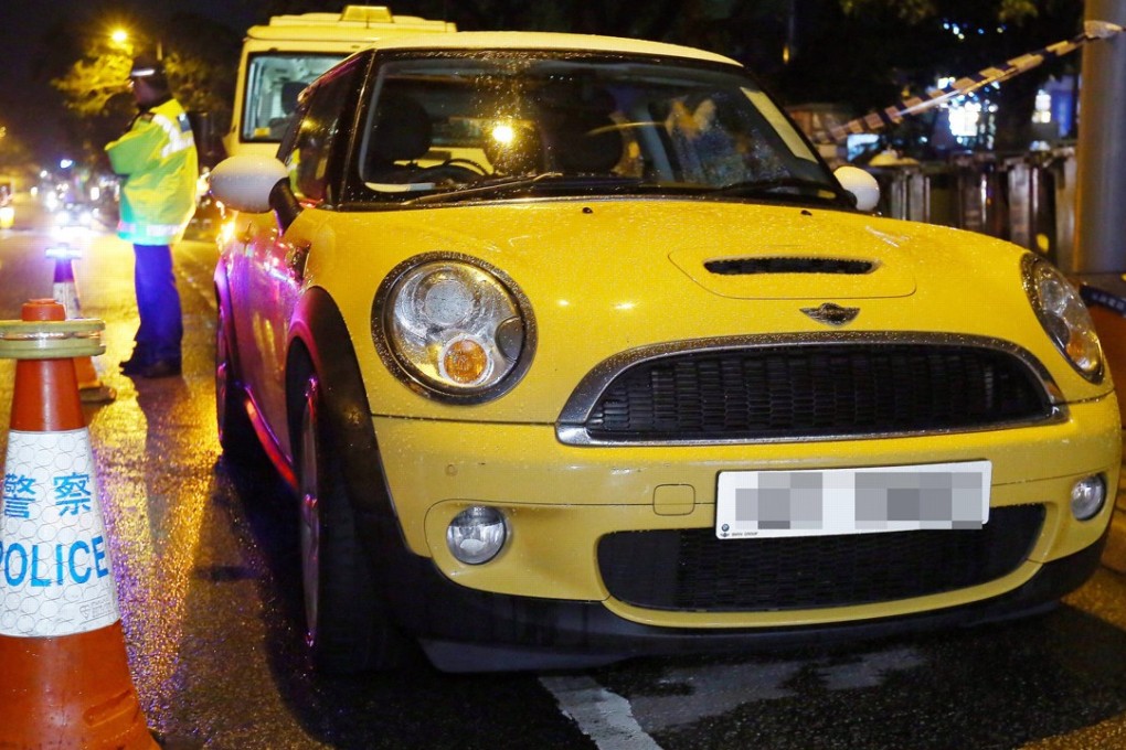 Wong Siew Fing and her daughter Lily Khaw Li Ling were found unresponsive inside this yellow Mini Cooper. Photo: Edmond So