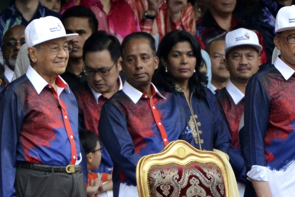Malaysian Prime Minister Mahathir Mohamad, left, watches national day celebrations in Putrajaya, Malaysia on August 31.