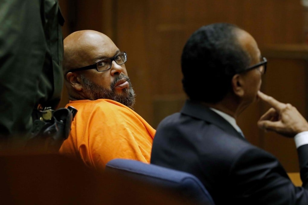 Marion “Suge” Knight (left), with lawyer Albert DeBlanc, pleads no contest to voluntary manslaughter in Los Angeles Superior Court on Thursday. Photo: Agence France-Presse