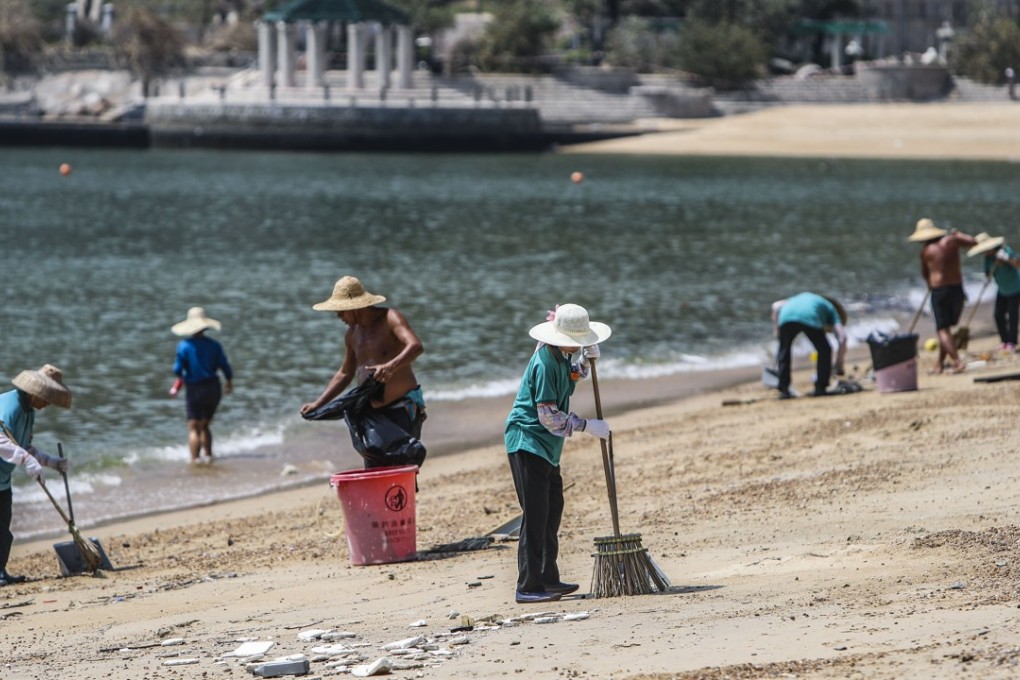 Workers clean up Hong Kong’s Clear Water Bay after Typhoon Mangkhut. Photo: Winson Wong