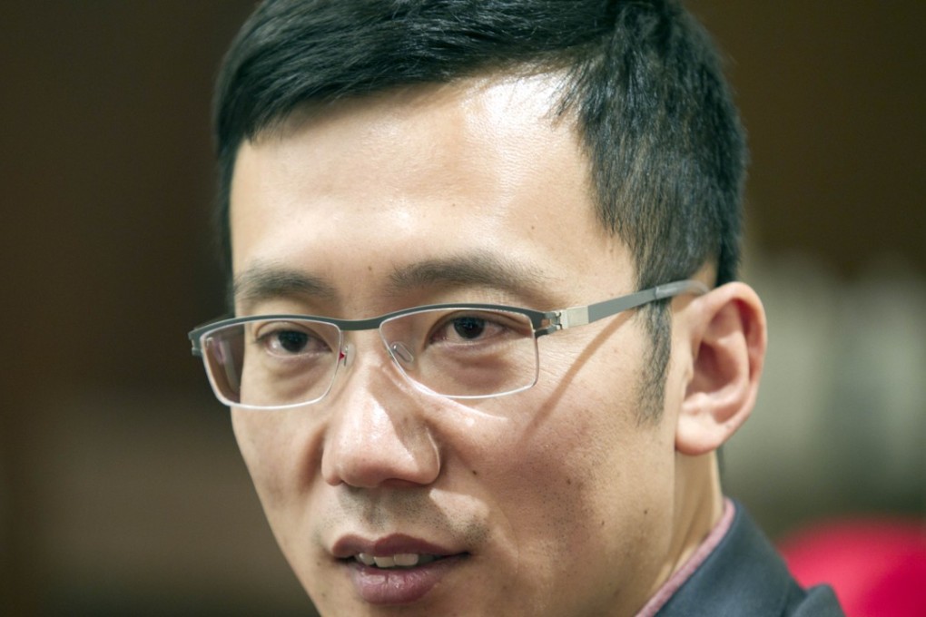 Yang Weiqing, president of iResearch Consulting Group, speaks during an interview in Beijing. Photo: SCMP